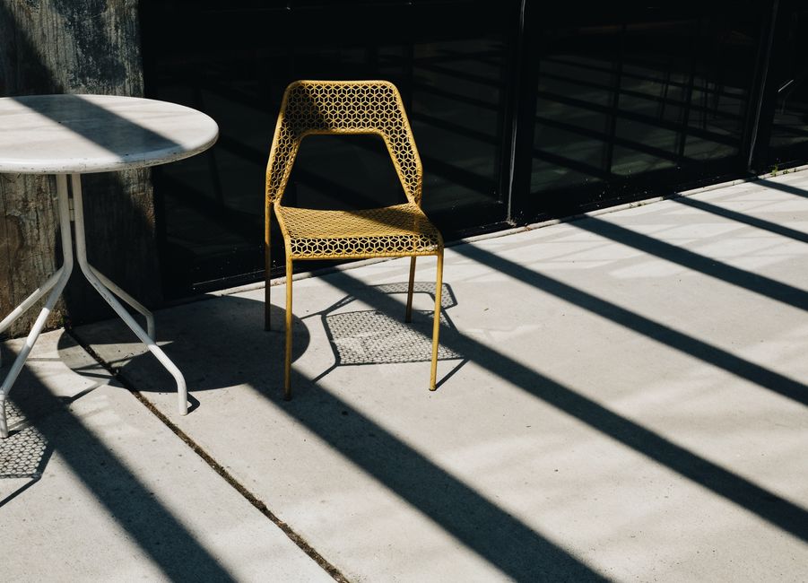 Concrete patio flatwork with outdoor furniture in Clovis CA by Longhorn Landscapes