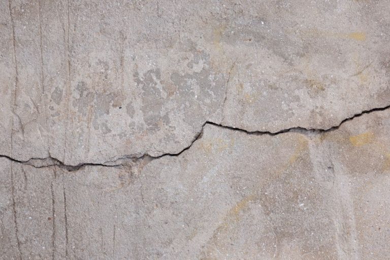 Cracked concrete surface showing damage common in Fresno's Central Valley climate